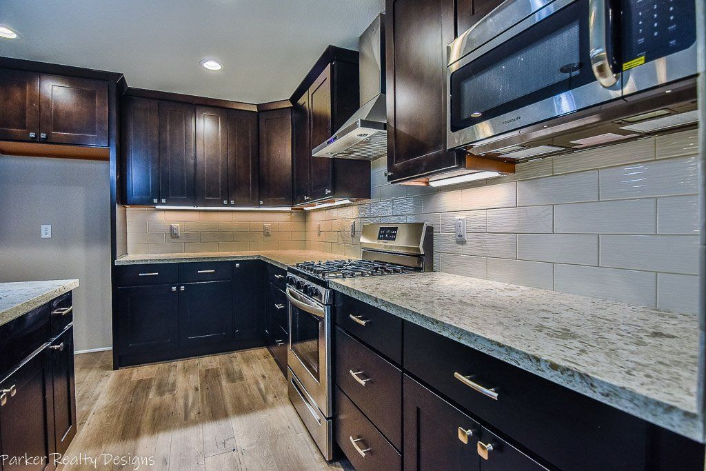 New construction. Large kitchen island with quartz counters.