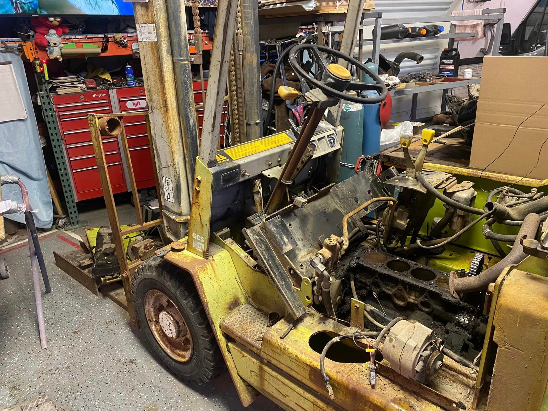 Forklift in A Garage with The Engine Removed — Santa Cruz, CA — Santa Cruz All Star Body Works