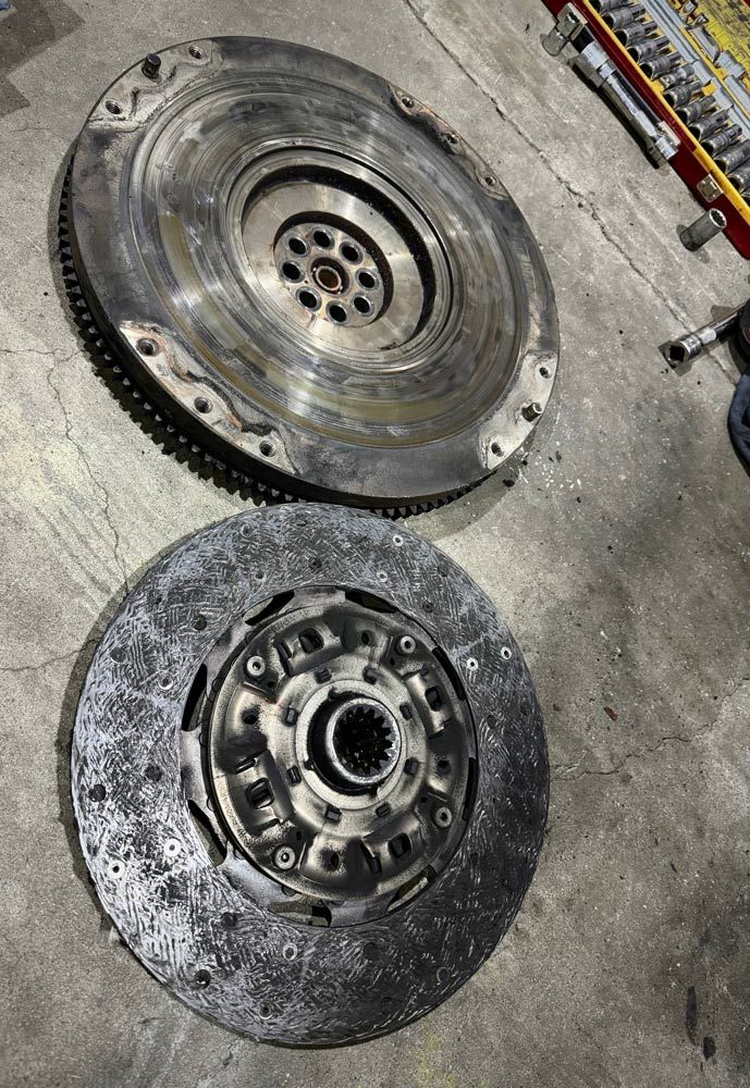 A Close Up of a Clutch and Flywheel on a Concrete Surface — Inline Truck and Plant in Tuggerah, NSW