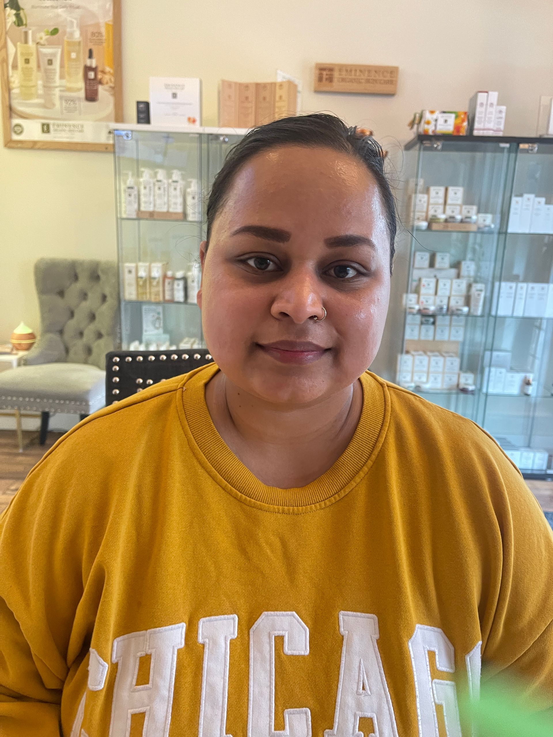 a woman wearing a yellow shirt that says chicago