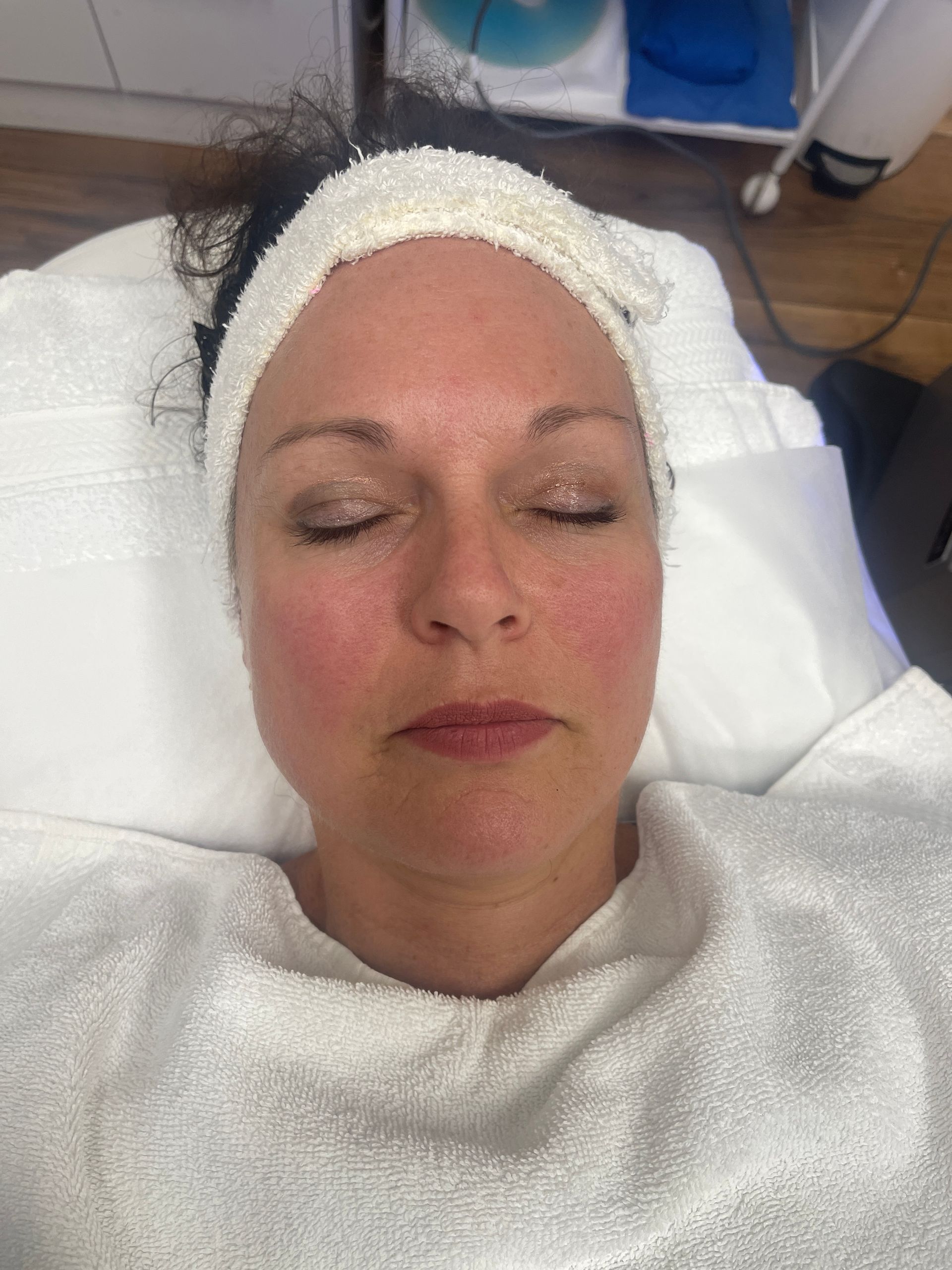 a woman with her eyes closed and a headband on her head