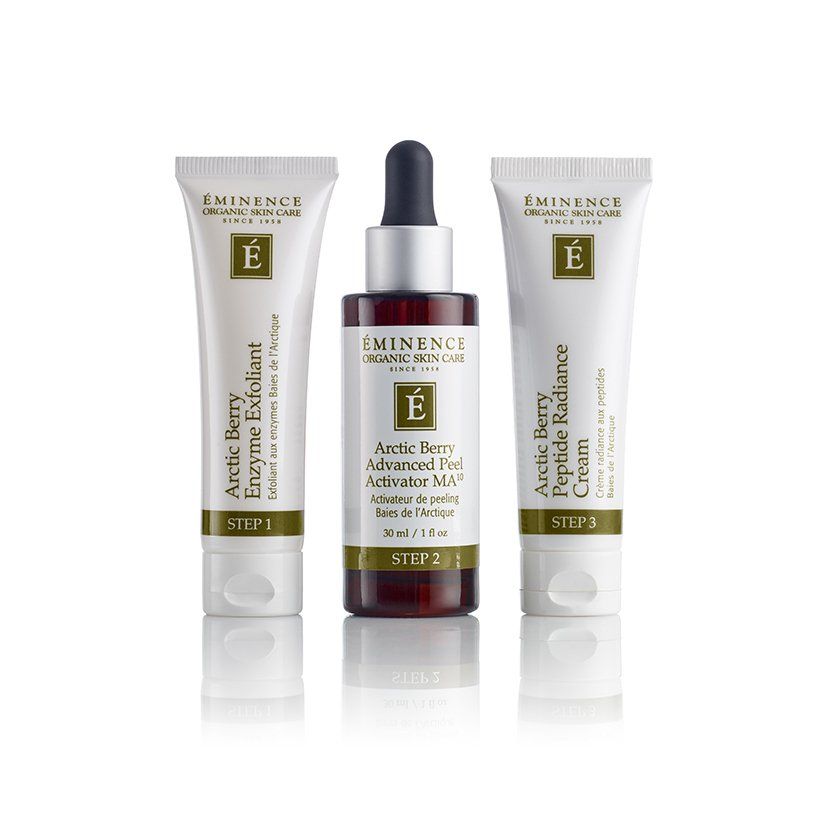 Three bottles of eminence arctic berry products are lined up on a white surface