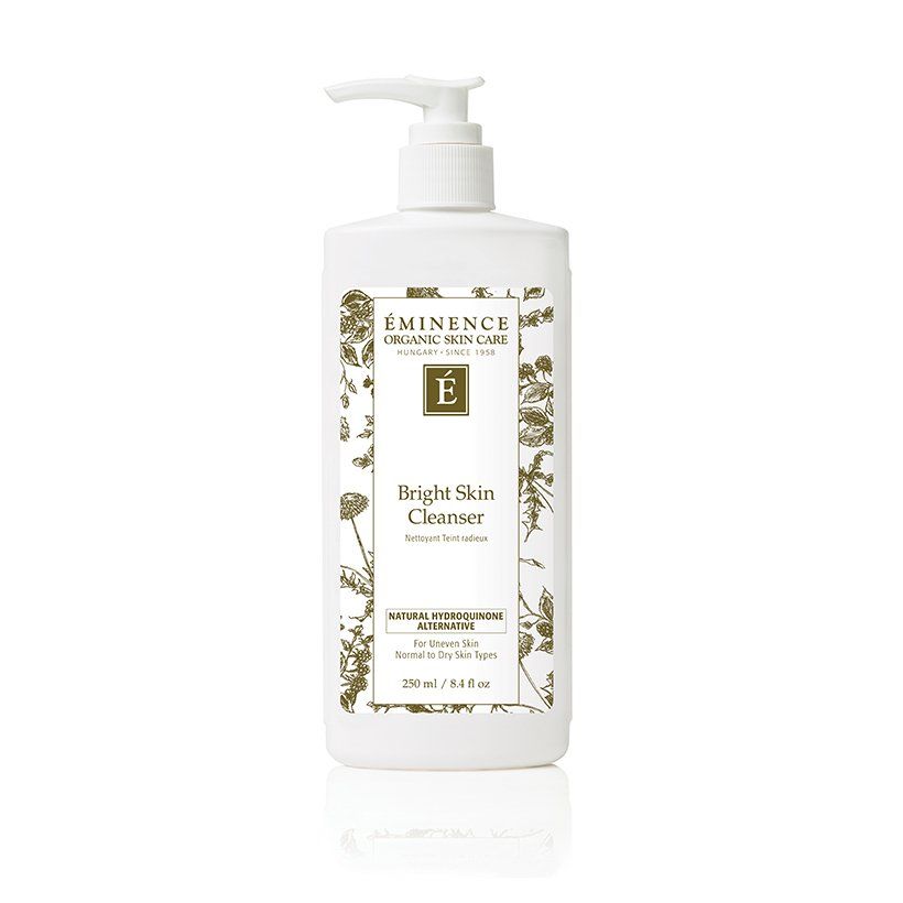 A bottle of eminence bright skin cleanser on a white background.