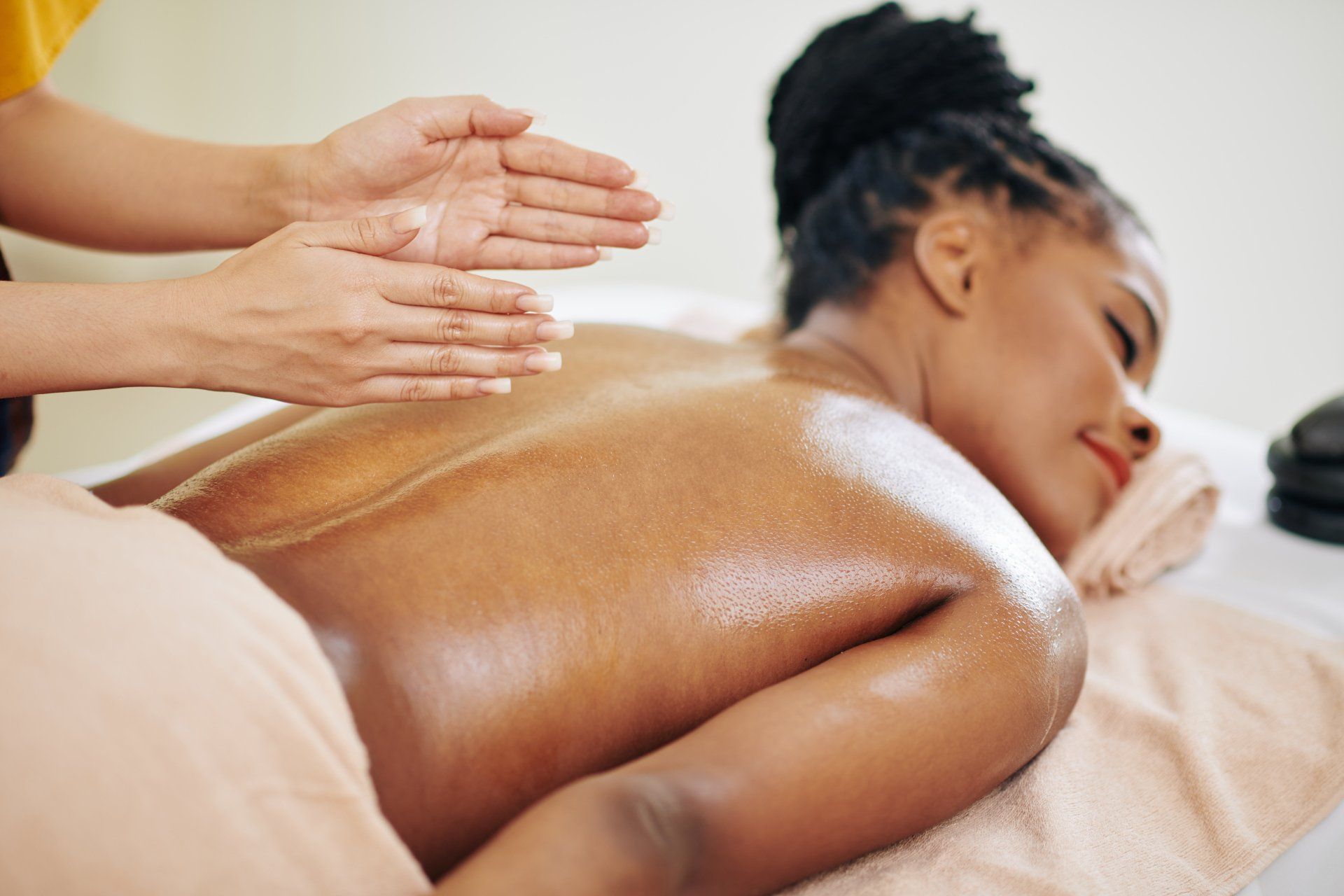 A woman is getting a massage at a spa.