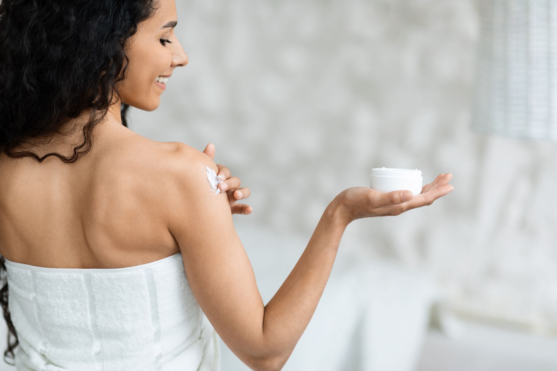 A woman is getting a facial treatment at a spa.