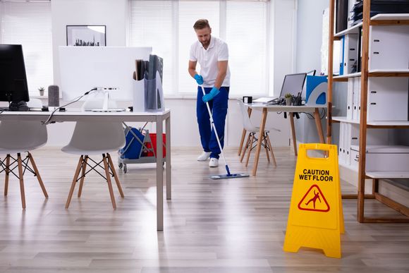 Man Mopping the Floor