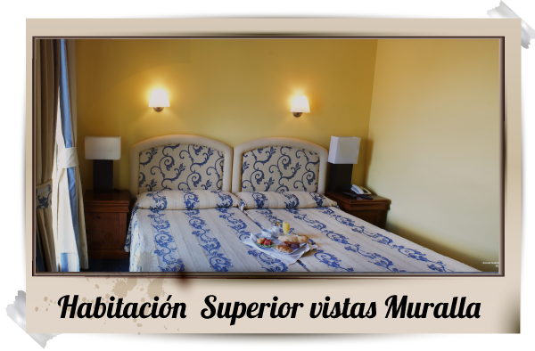 Una imagen de un dormitorio con las palabras habitacion superior vistas muralla.