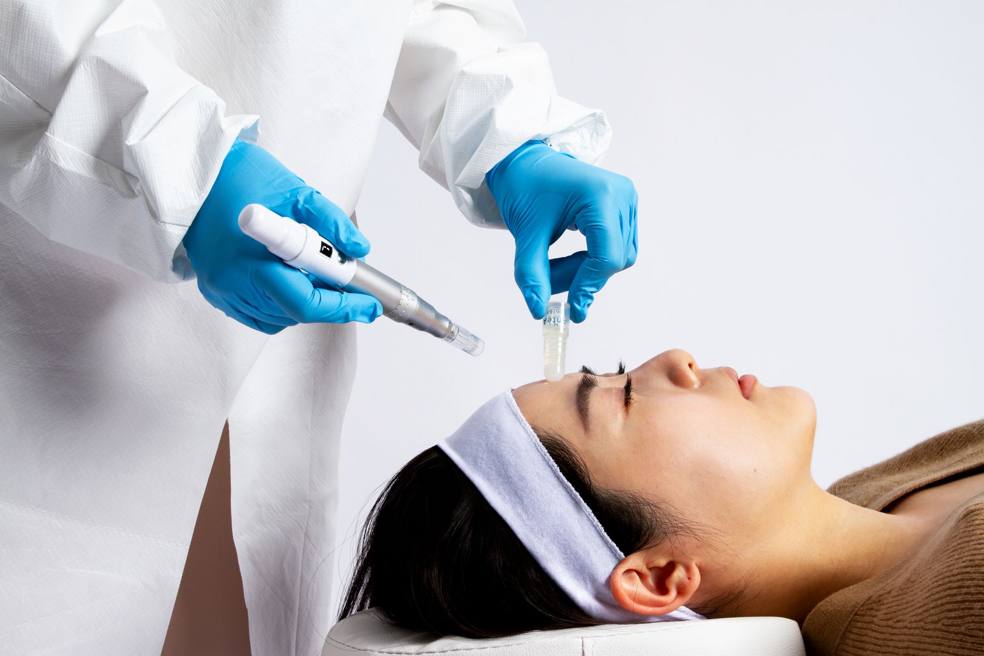 dermatologist demonstrating AnteAGE treatment female model