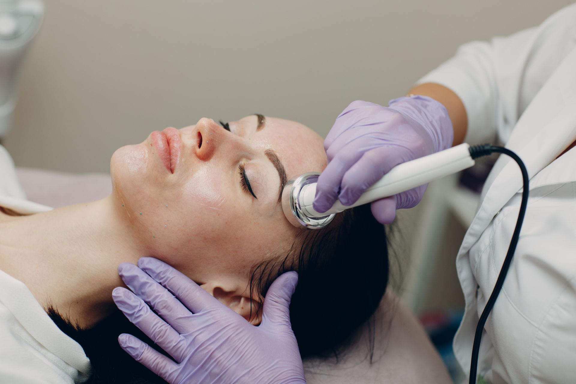 Close Up Of A Woman Receiving Ultrasound Facial Therapy – Terrigal, NSW - Anjule Beauty Therapy