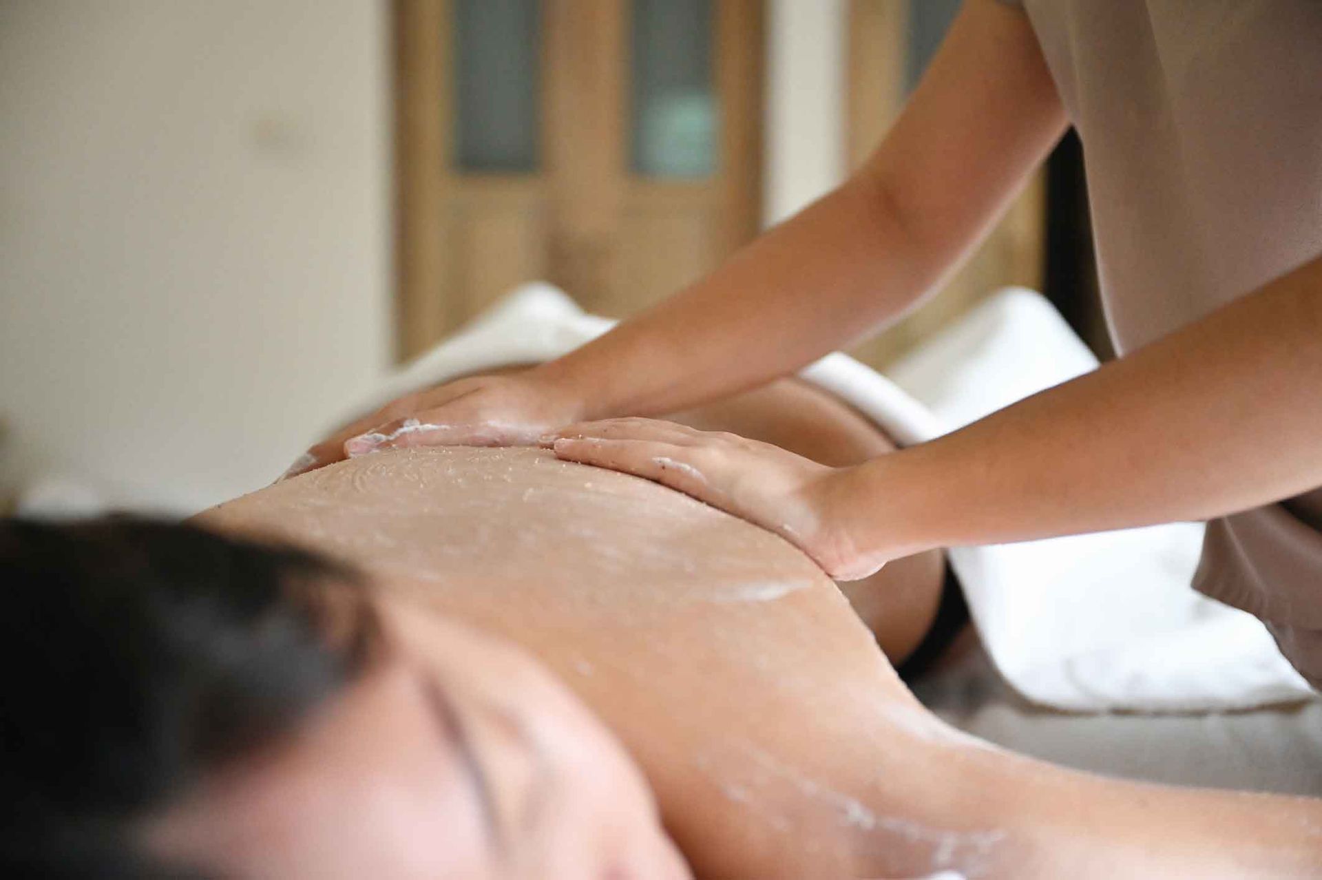 Woman Receiving A Body Scrub – Terrigal, NSW - Anjule Beauty Therapy
