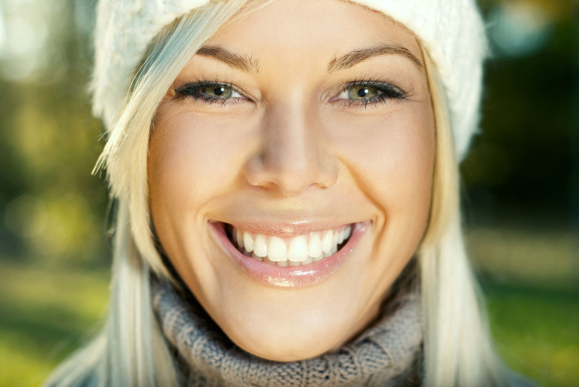 A Close Up Of A Woman Wearing A Hat And Smiling – Terrigal, NSW - Anjule Beauty Therapy