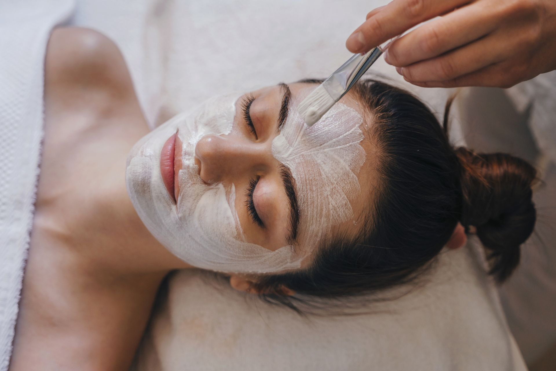 A Woman Is Receiving A Facial Treatment At A Spa – Terrigal, NSW - Anjule Beauty Therapy
