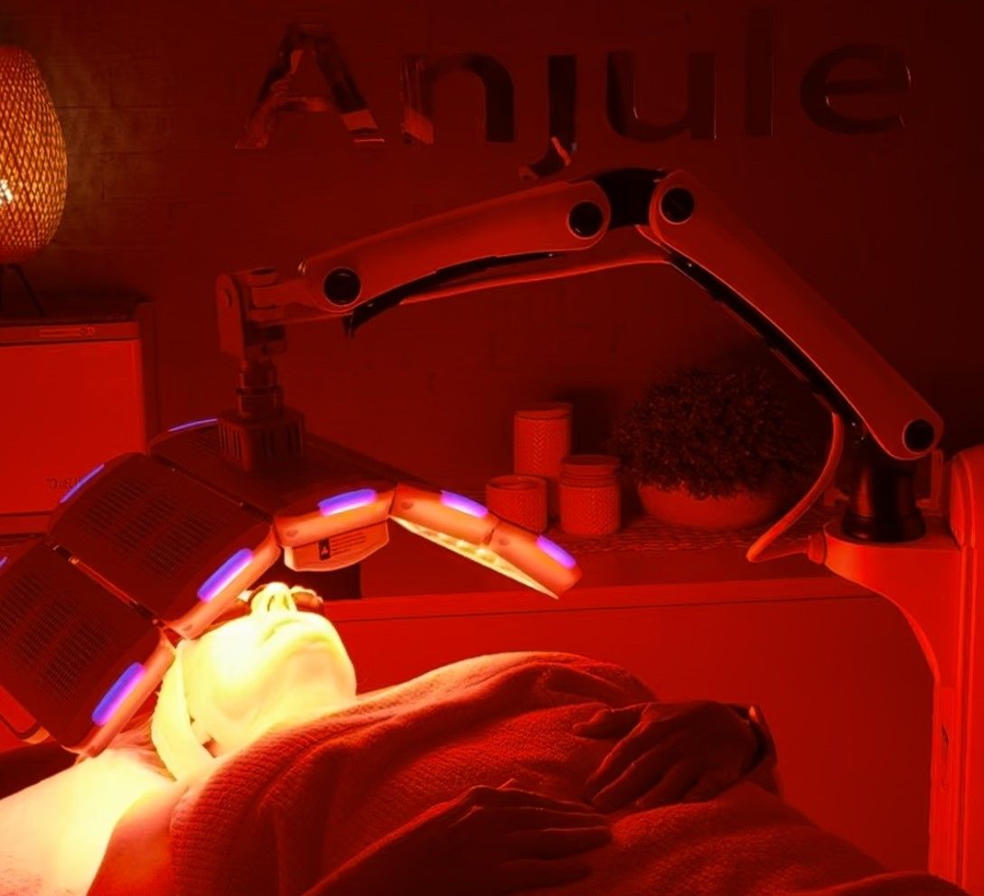 A Woman Is Getting A Red Light Treatment On Her Face – Terrigal, NSW - Anjule Beauty Therapy