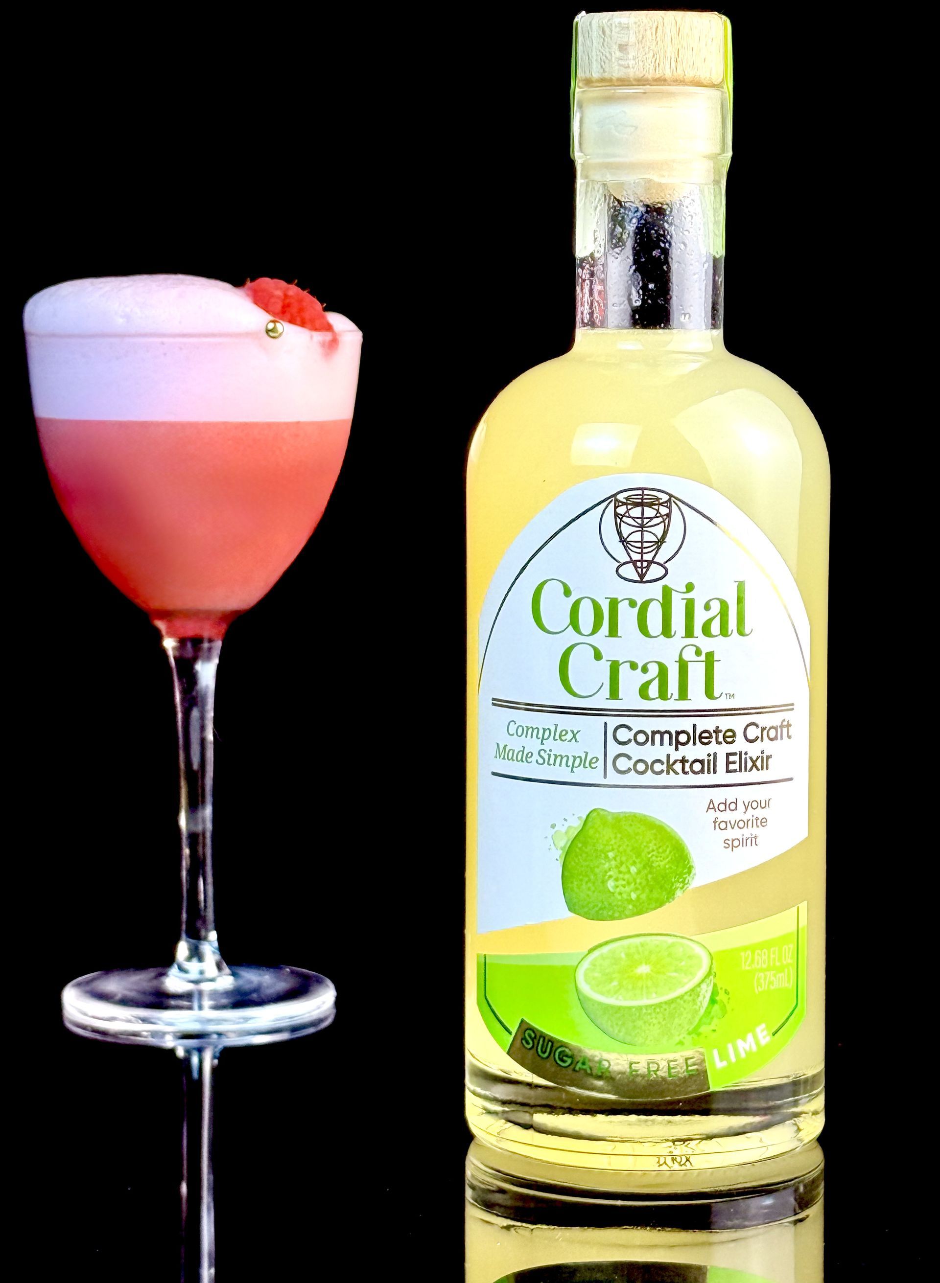 A bottle of cordial craft next to a glass