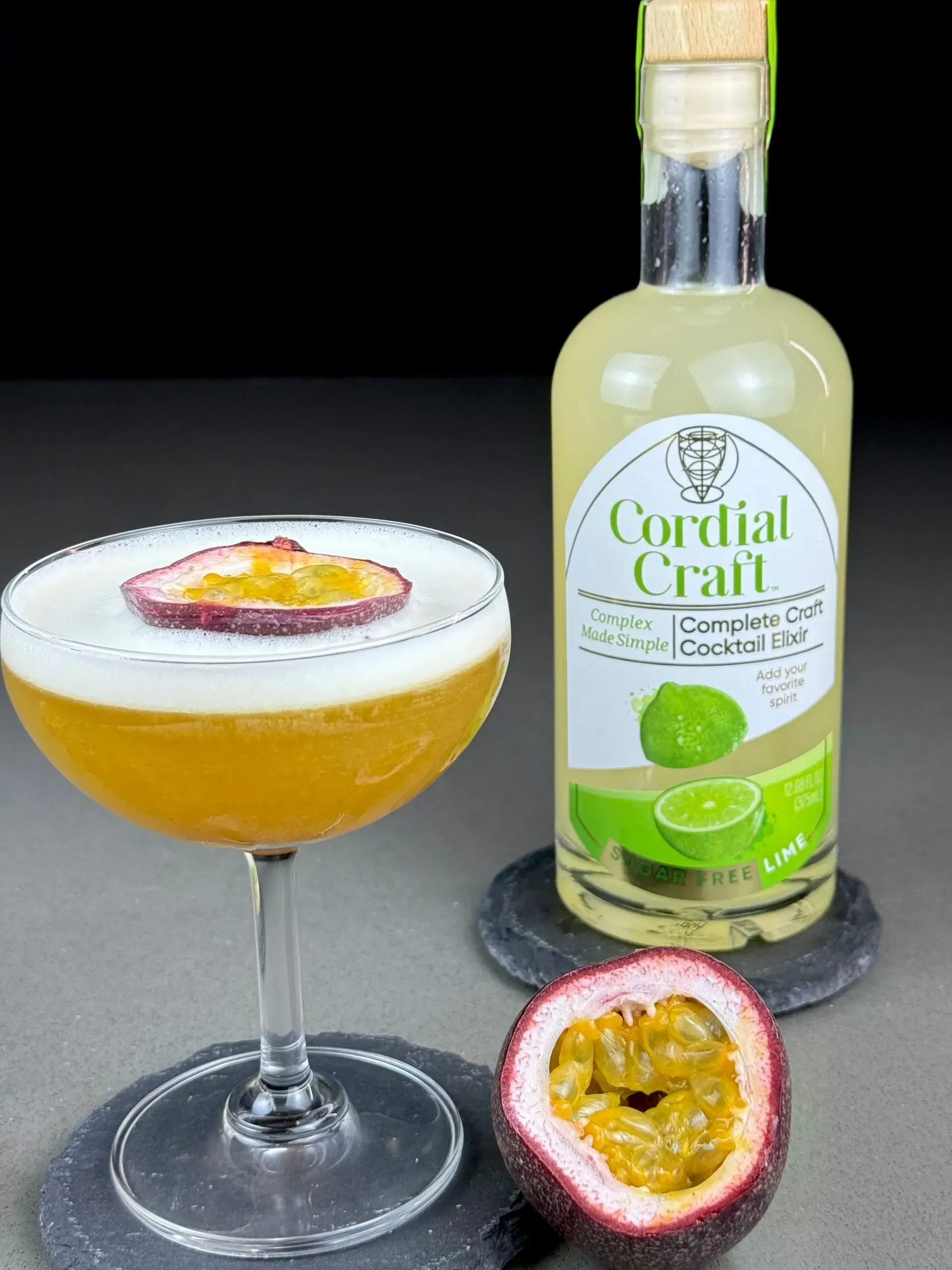 A bottle of cordial craft next to a glass of drink