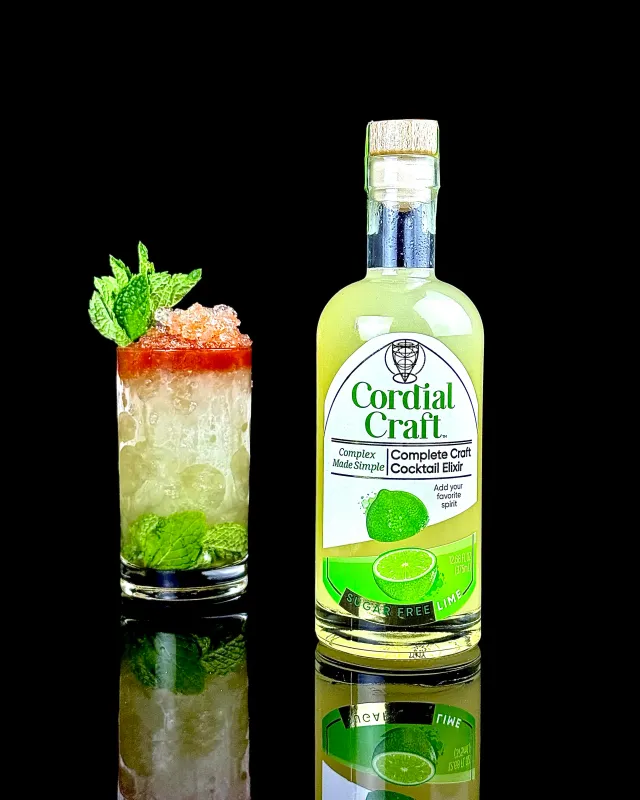 Queen's Park Remix cocktail beside a bottle of Cordial Craft