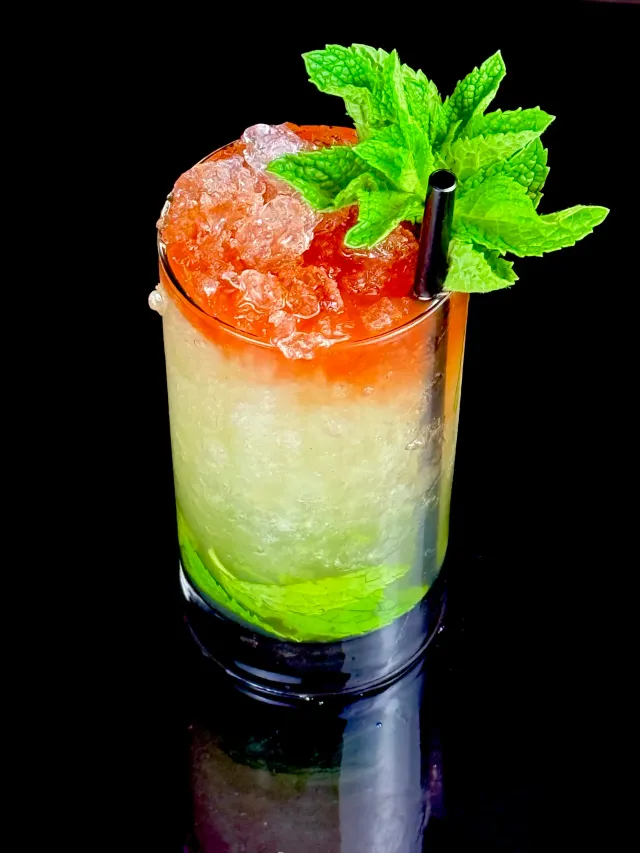 Queen's Park Remix rum and mint cocktail made with Cordial Craft against a black background