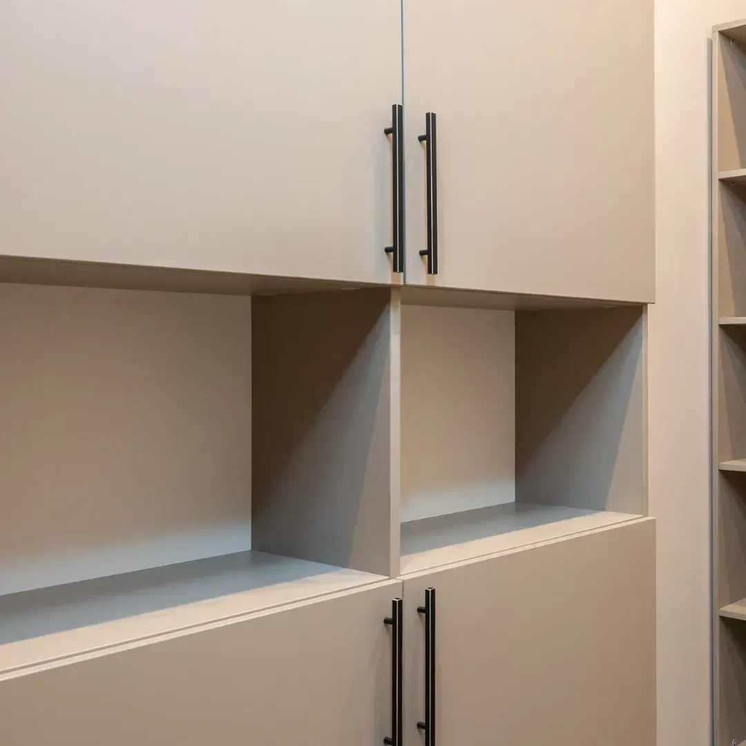 A room with a lot of cabinets and shelves