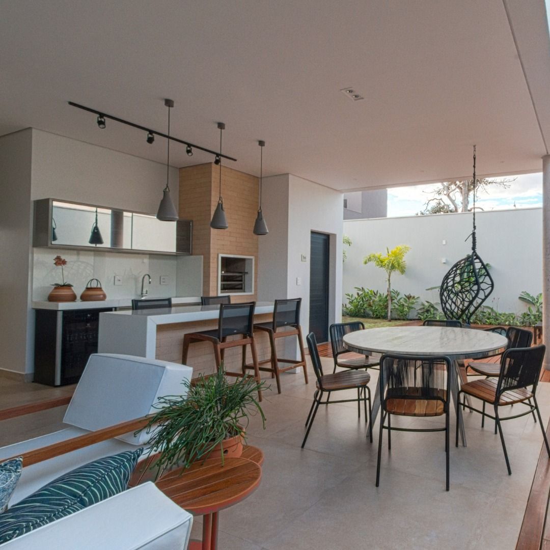 There is a table and chairs in the middle of the room.