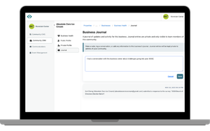 Green hand holding globe with two hearts.