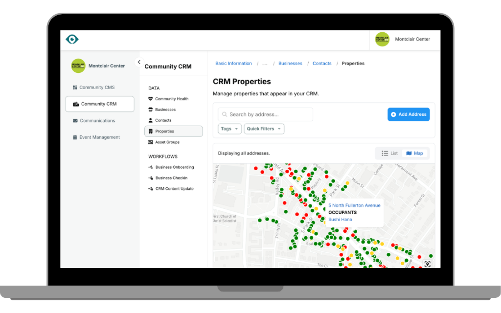 Building with stacks of coins and a small tree.