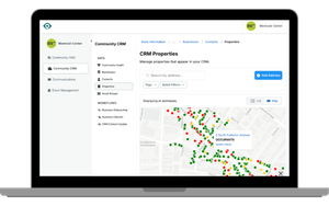 Building with stacks of coins and a small tree.