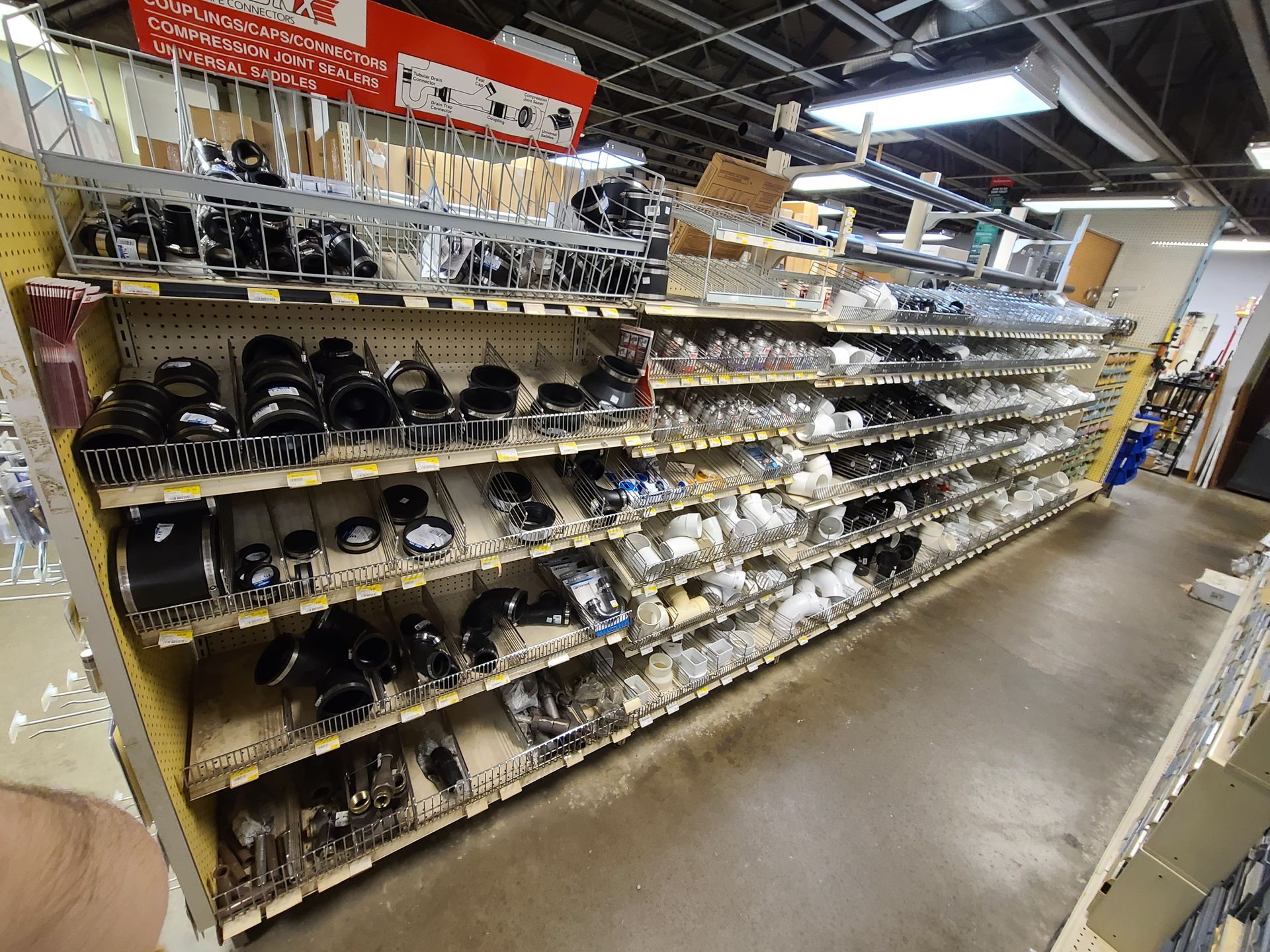 A store aisle with a sign that says ' a ' on it