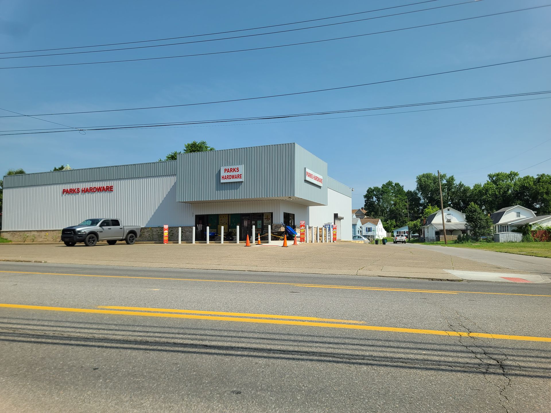 A white building with a sign that says ' a & r ' on it