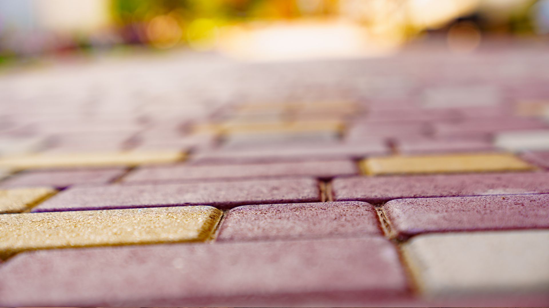 Red and yellow blocks installed on a driveway.