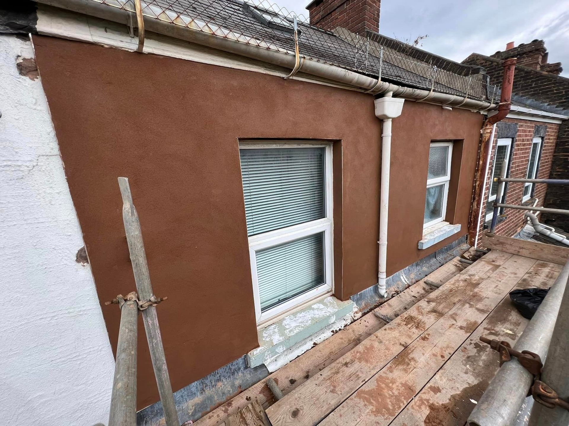 A newly painted house in brown.