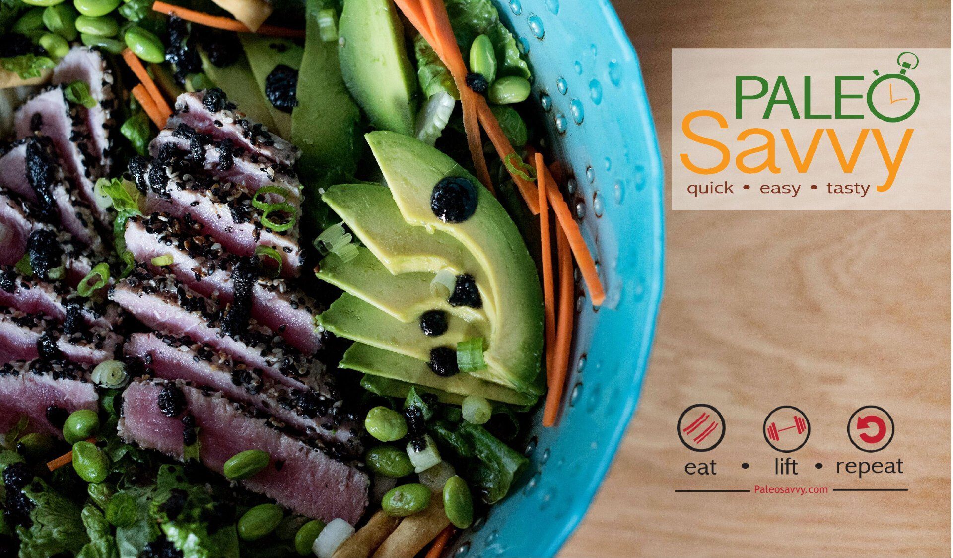 A salad in a blue bowl with the words paleo savvy on the bottom