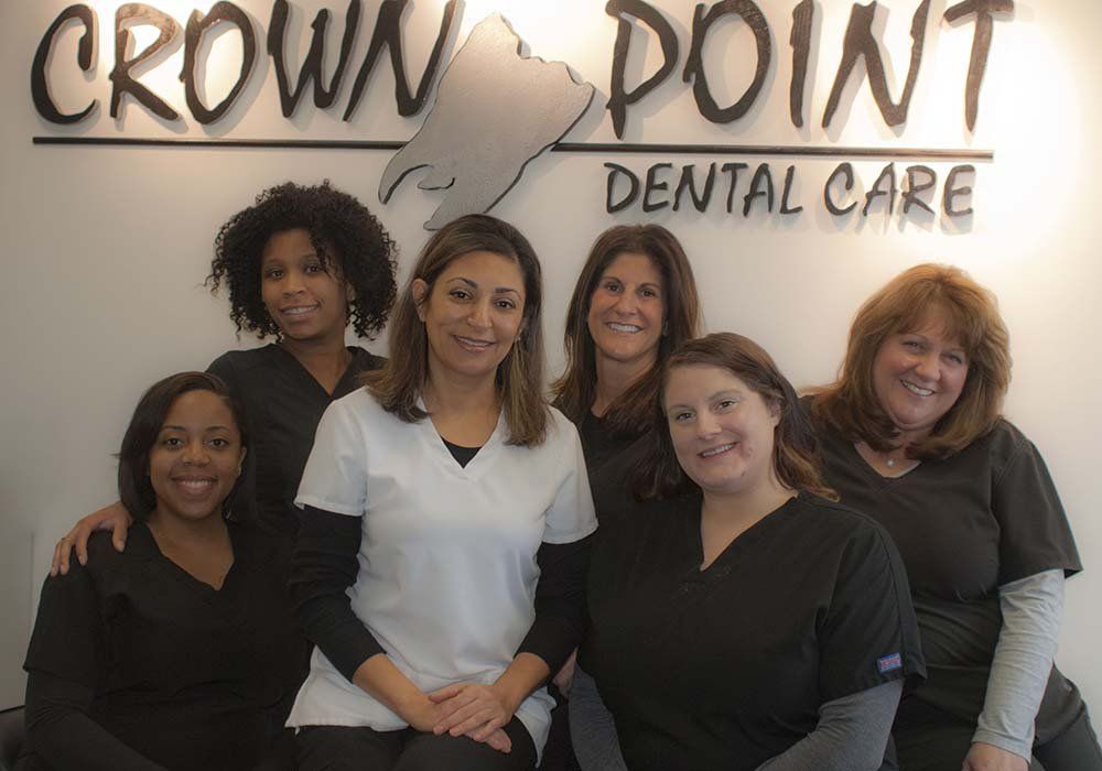 Crown Point Staff Sitting and Smiling
