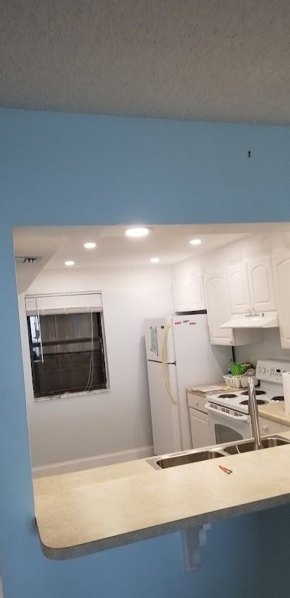 View of a kitchen through a blue opening