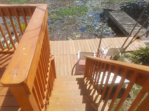 Wooden deck and stairs leading to water