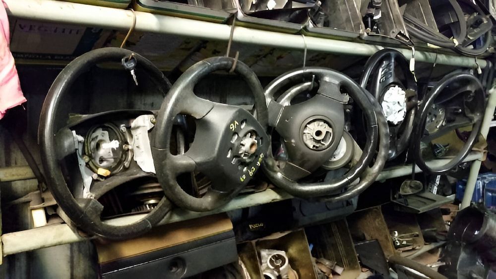 Steering Wheels Hanging on a Rack — Crypto Parts In Tuggerah, NSW