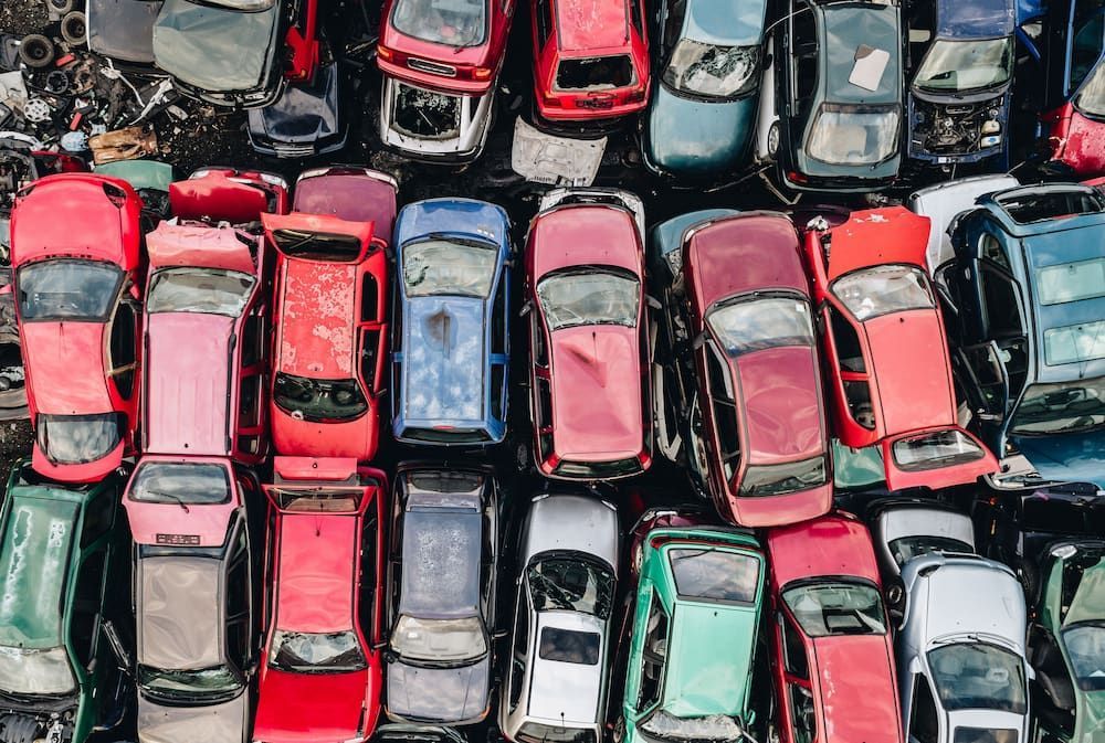 Overhead View of a Junkyard Filled With Rows of Colourful, Wrecked Cars — Crypto Parts In  Tuggerah, NSW
