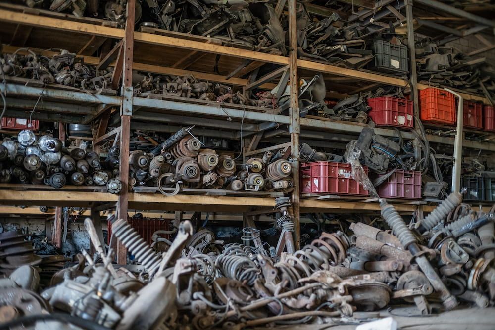 Shelves Overflowing With Rusty Car Parts in a Warehouse Setting — Crypto Parts In Tuggerah, NSW