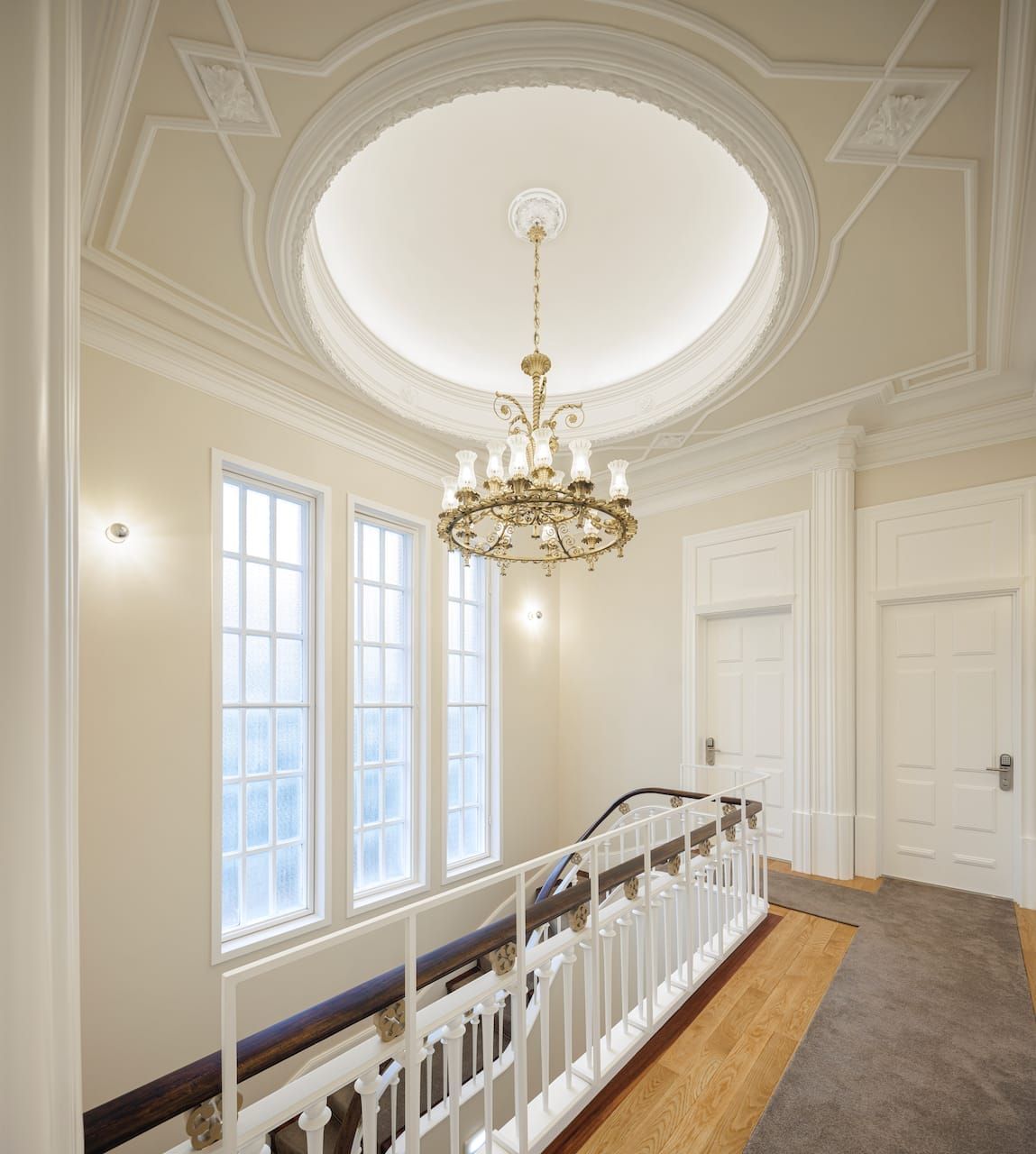 Restored stairwell and chandelier at Casa Kala, designed by architect Januário Godinho.