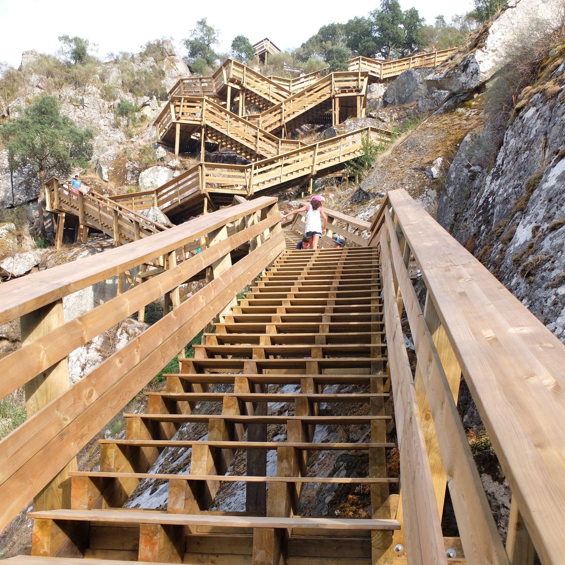 Wooden staircase of the Paiva Walkways zigzagging up a rocky hillside