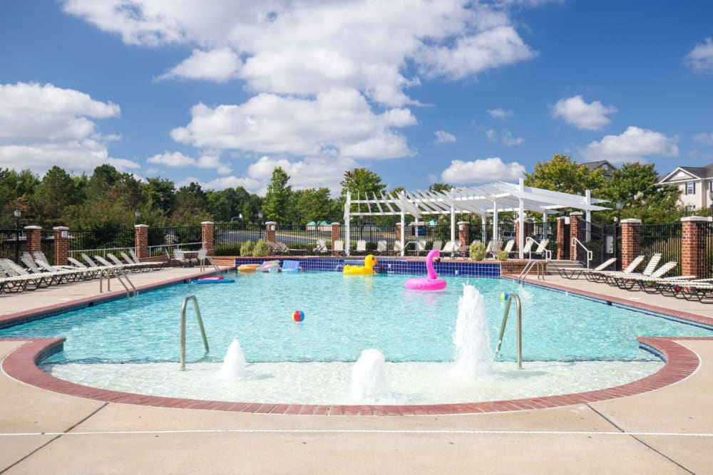 A large swimming pool with a fountain.