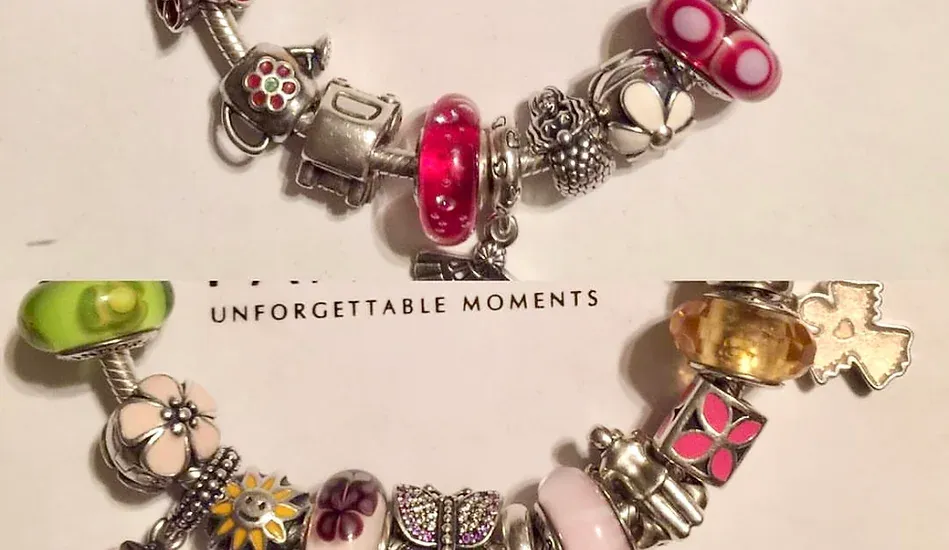 Two bracelets are on a card that says unforgettable moments