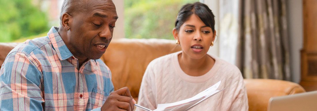 A couple at home talking about superannuation
