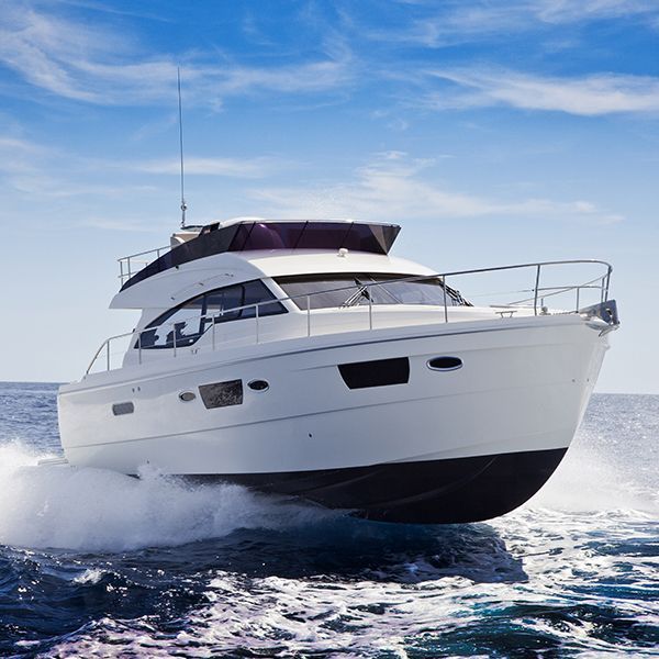 Luxury motor boat on the water against a blue sky