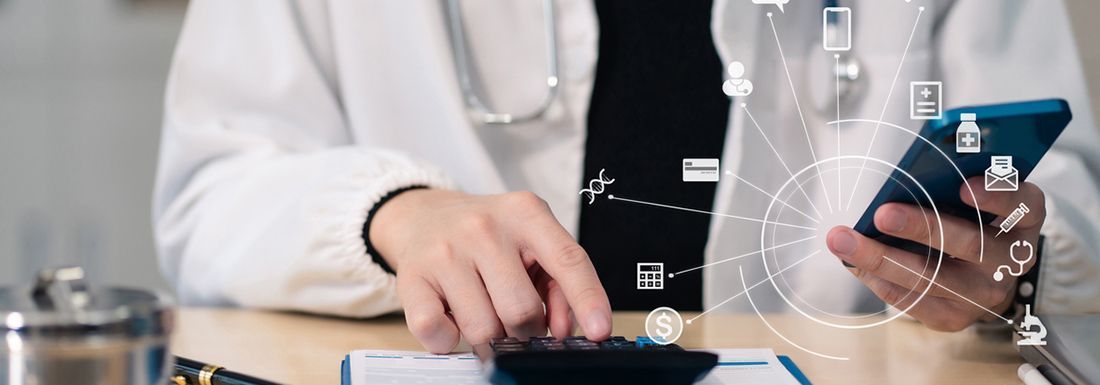 A doctor calculating a medical bill