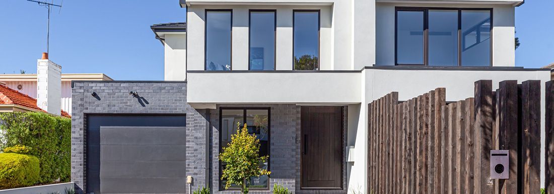 Front view of modern double storey townhouse entrance 
