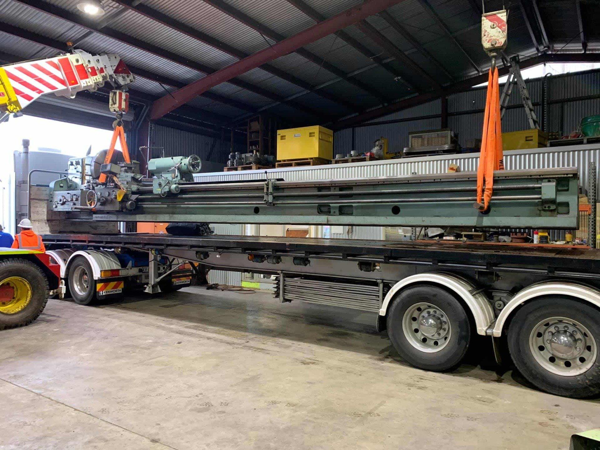 Heavy Machine Loaded In Truck — Engineering in Tamworth, NSW
