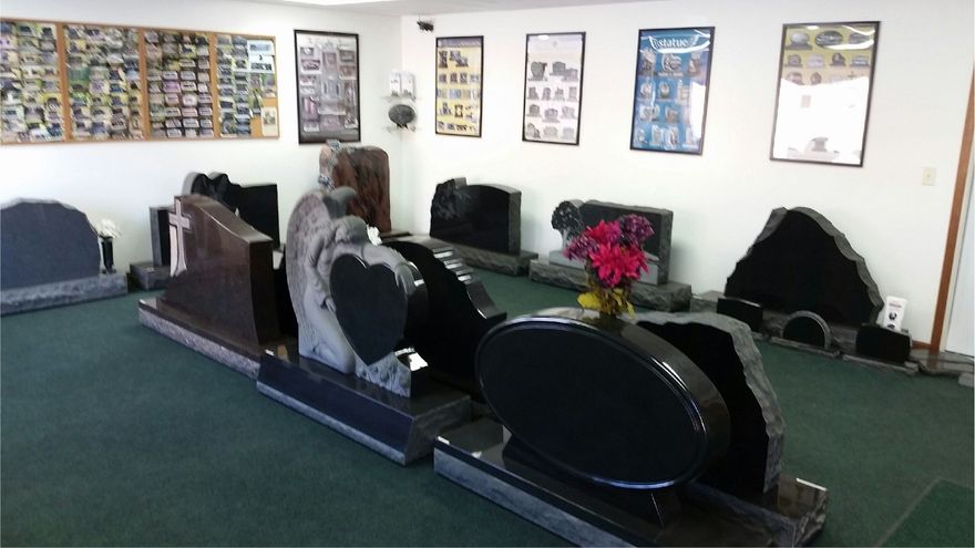 Gravestone showroom with various headstone displays.