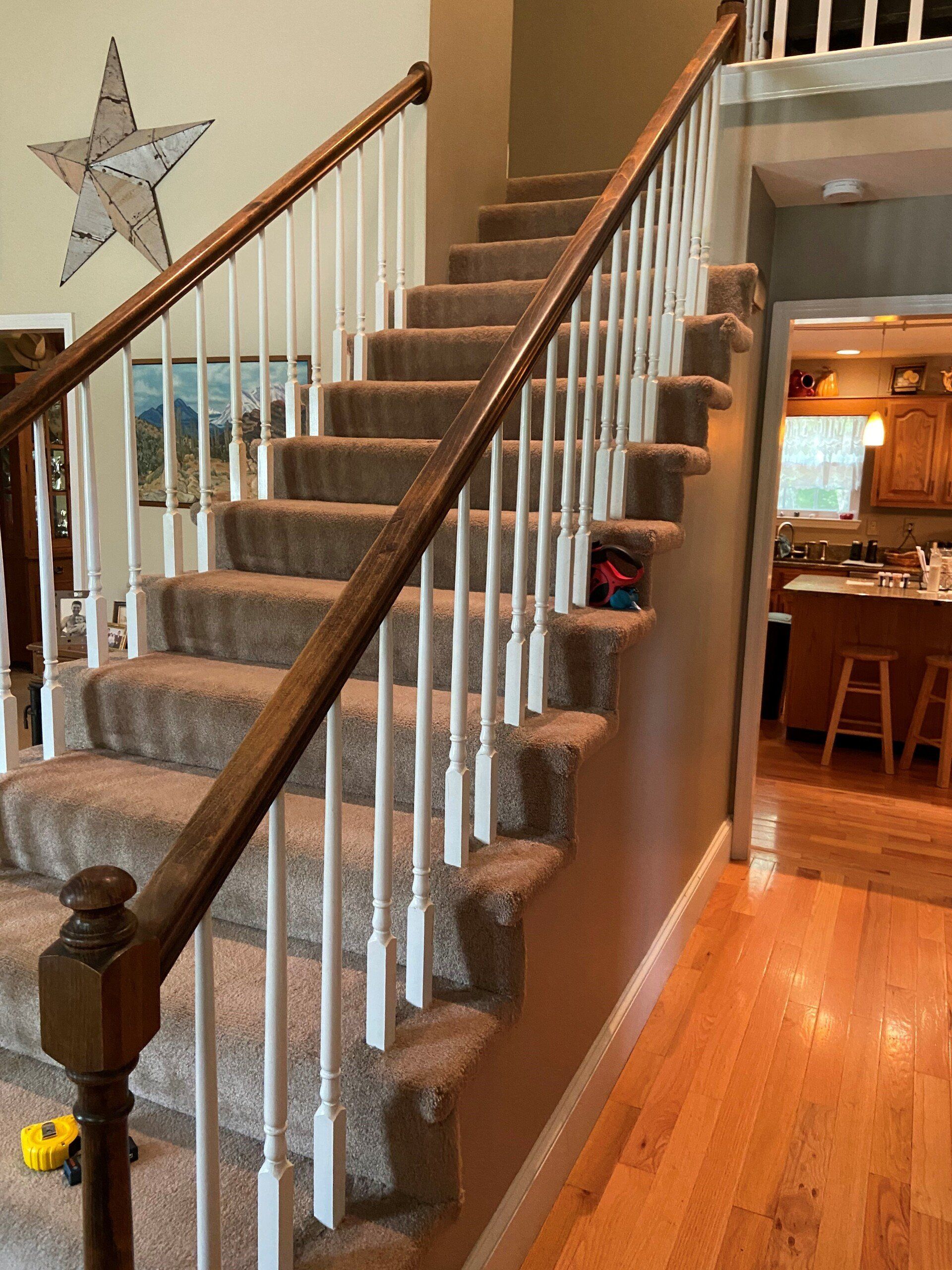 A staircase with a star on the wall above it