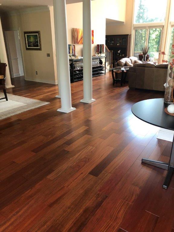 A living room with hardwood floors and a table