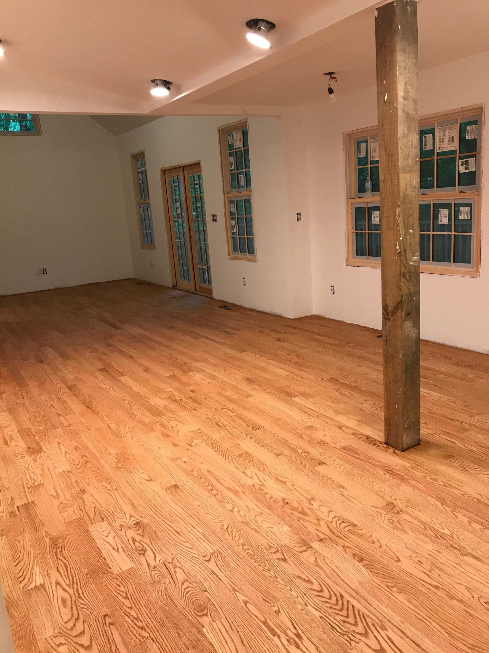 There is a wooden floor in the middle of the room.